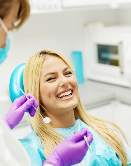 Laughing woman in dental treatment room