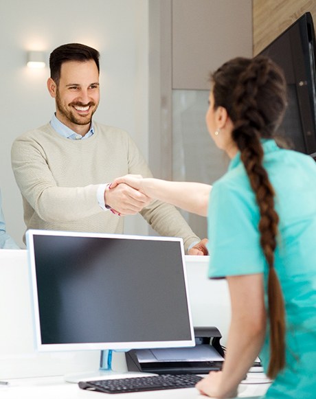 Couple with dental receptionist in Marysville