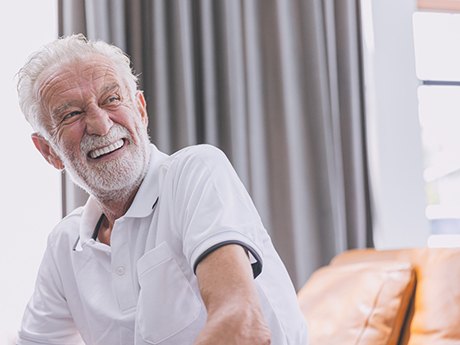 Older man smiling with dentures in Marysville