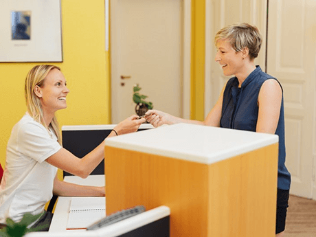 a patient paying for the cost of dentures