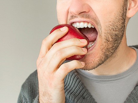 man eating an apple