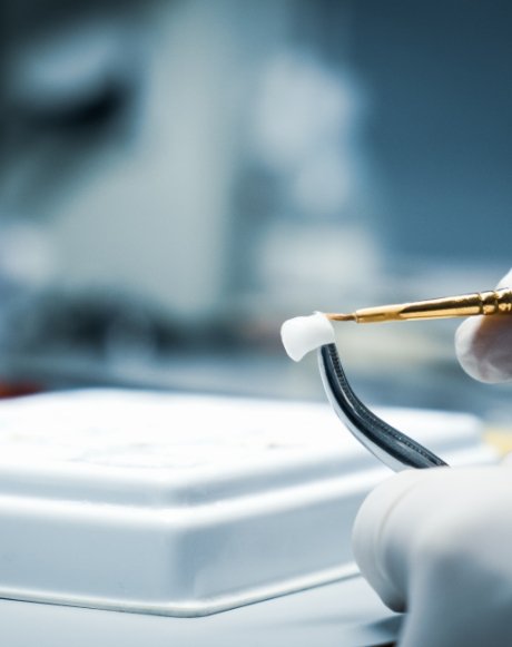 Dental lab technician crafting a dental crown