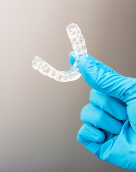 Hand holding an occlusal splint