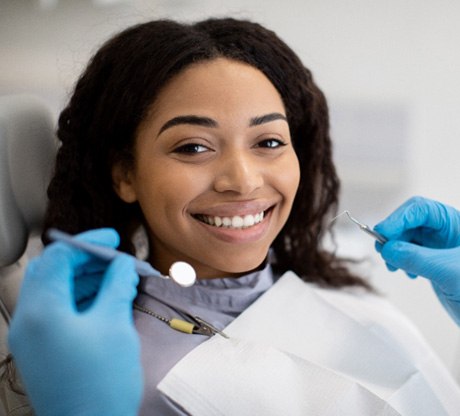 Young girl smiling after teeth whitening in Marysville 