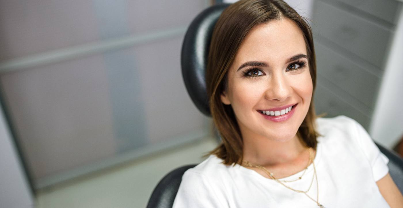 A smiling woman at the dentist’s office