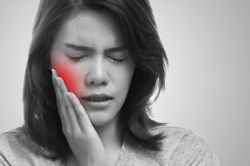 A pained and upset woman who didn’t get a root canal
