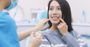 Woman at cosmetic dentistry consultation