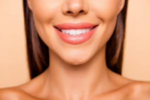 a woman with lipstick smiling 
